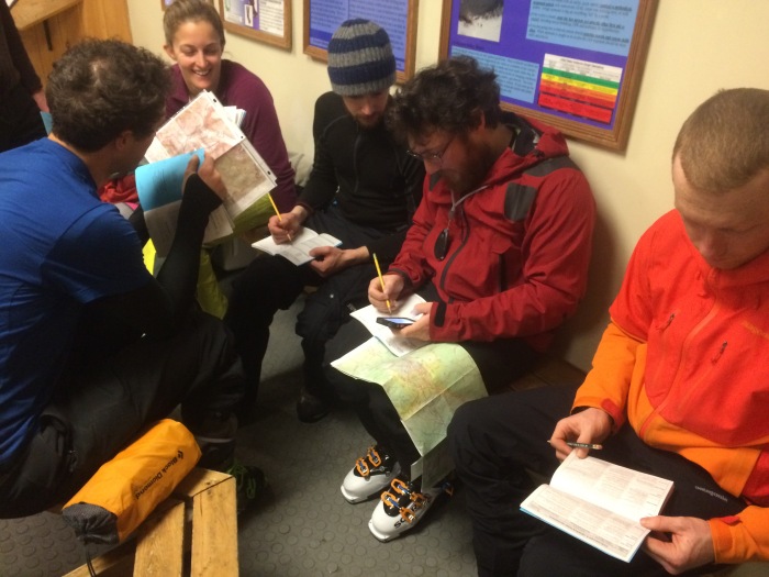 Alpha group works through some trip planning before heading up the hill